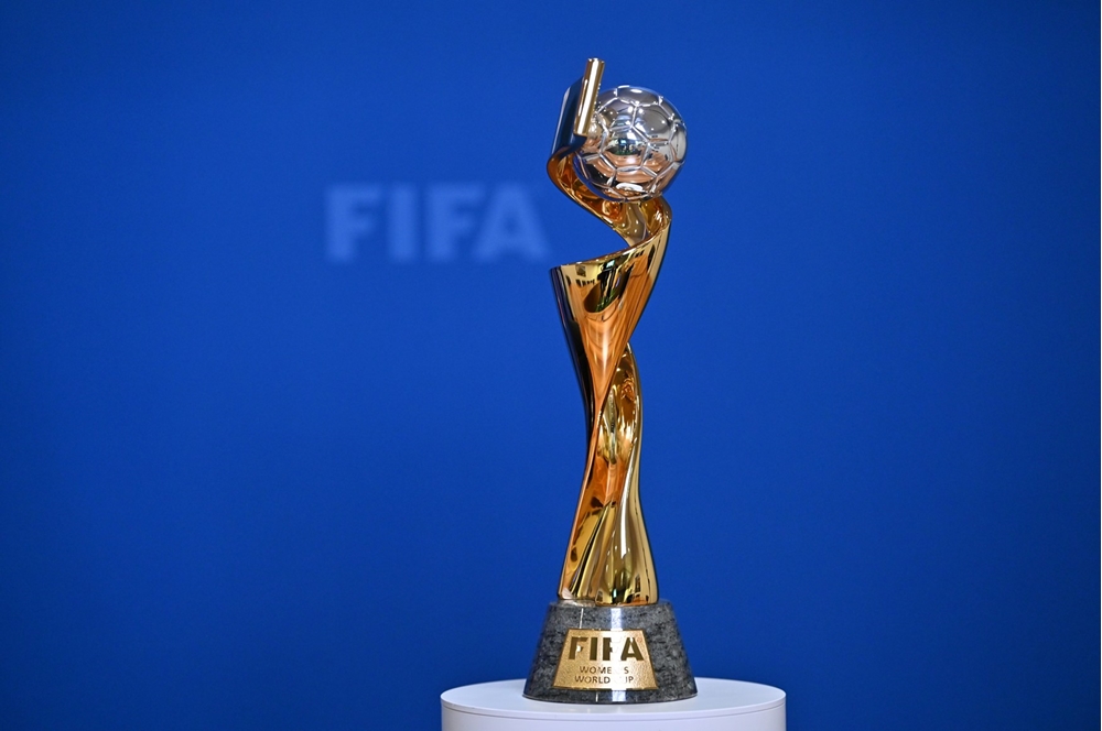 A detailed view of the FIFA Women's World Cup trophy on a plinth.