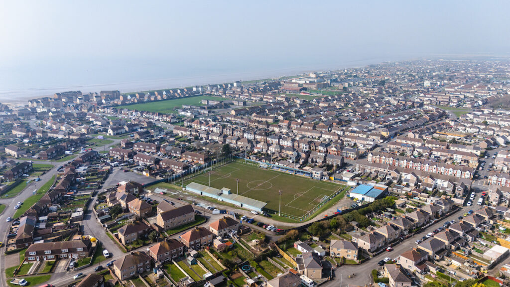 Aerial picture of a football stadium in Port Talbot surrounded by houses. 